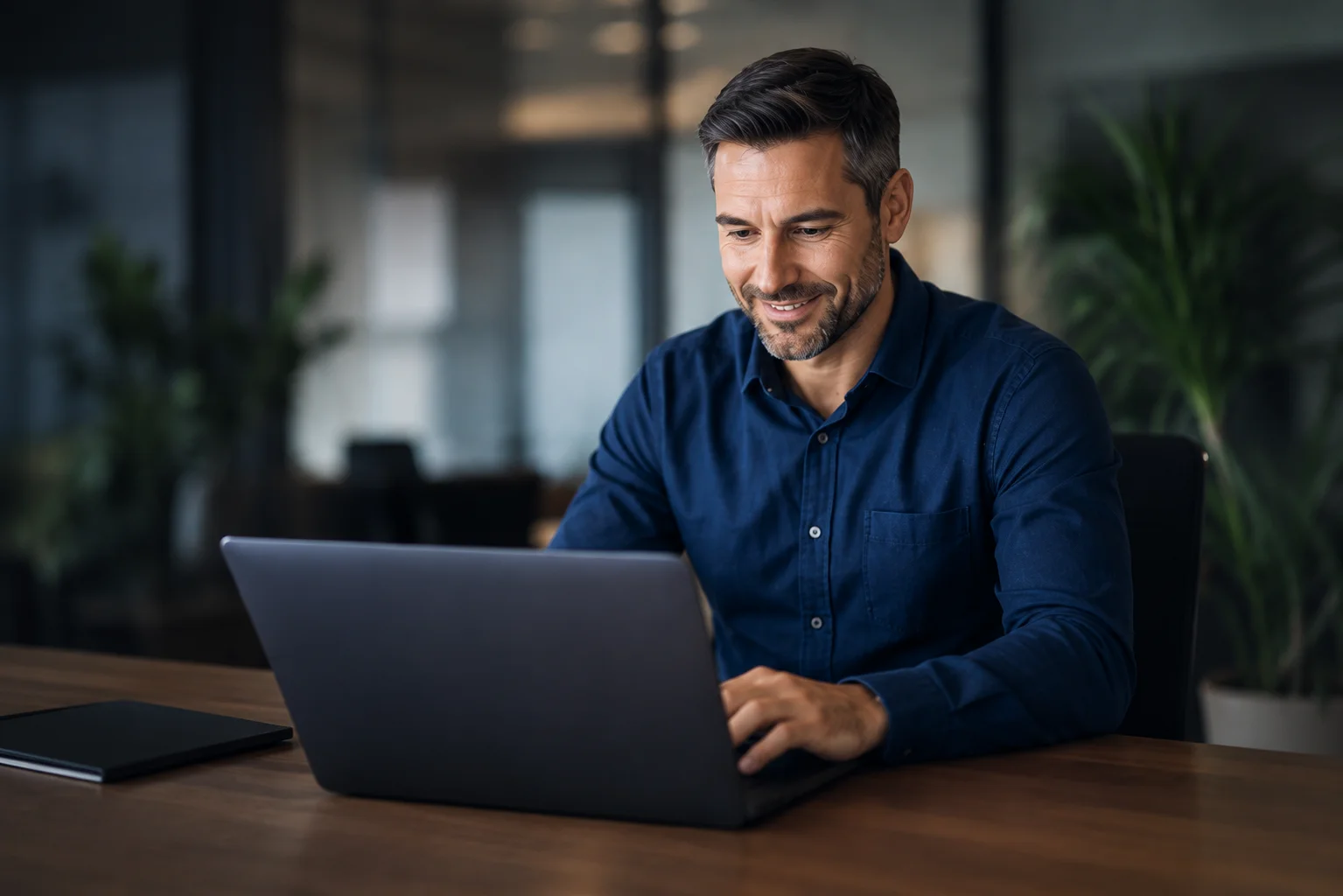 Business manager using AI automation tools at their desk